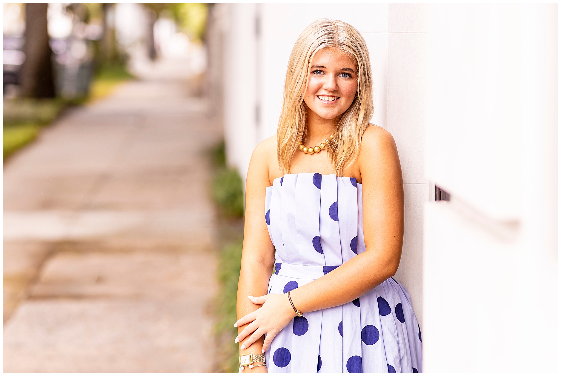 Charleston senior photographer captures elegant, joyful portraits on Meeting Street and Tradd Street.