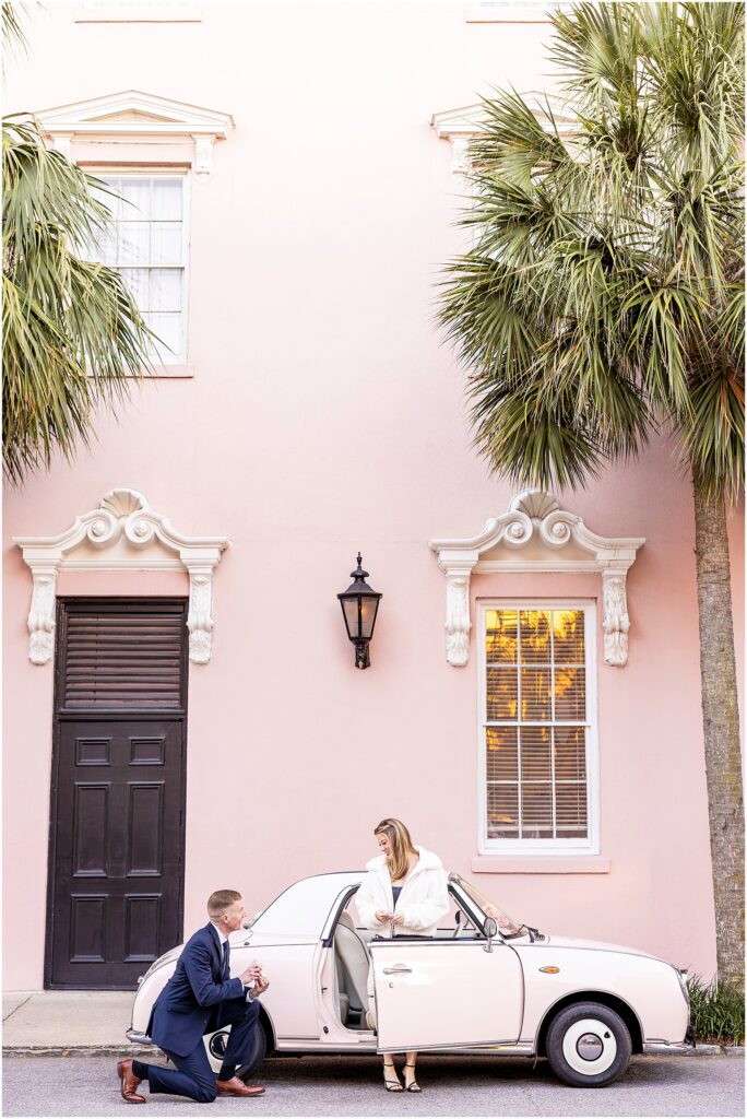 Matt kneels to propose to Taylor during their New Year’s Eve engagement at The Pink Figgy in Charleston.