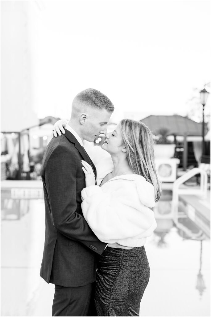 Matt and Taylor smiling at each other during their engagement photos.