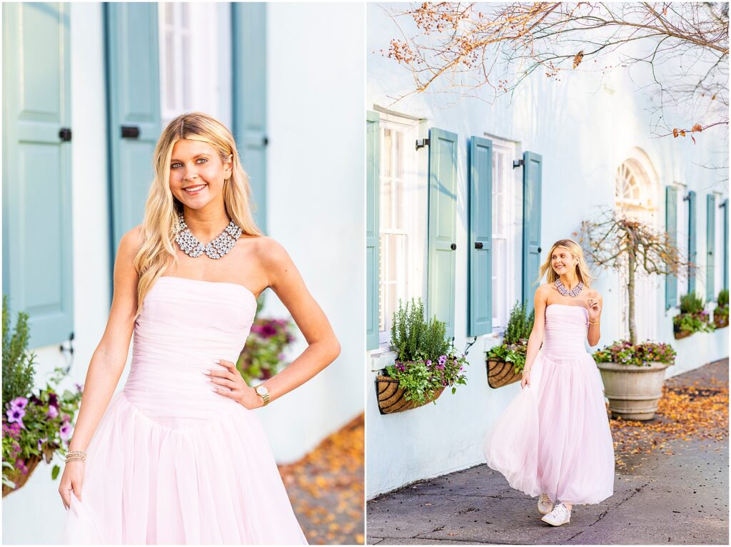 Bella laughing while walking in a pink fluffy dress along Rainbow Row for her destination senior portraits.