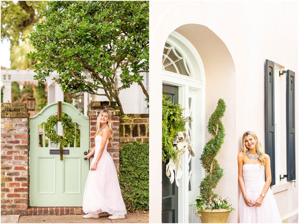 Bella leaning against a railing with historic Charleston architecture on Tradd Street behind her.