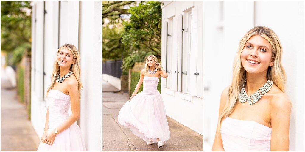 Bella posing confidently in front of a colorful building near Rainbow Row for her senior portraits.