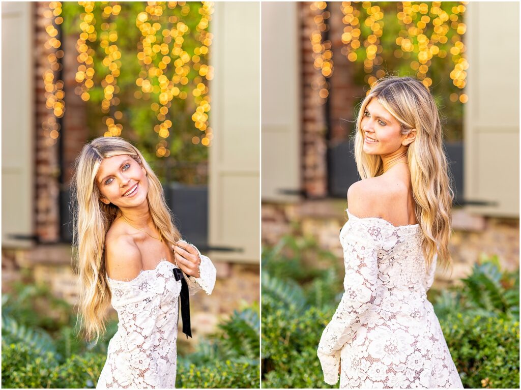 Bella leaning on a fence with warm sunlight along Tradd Street for her Charleston senior portraits.