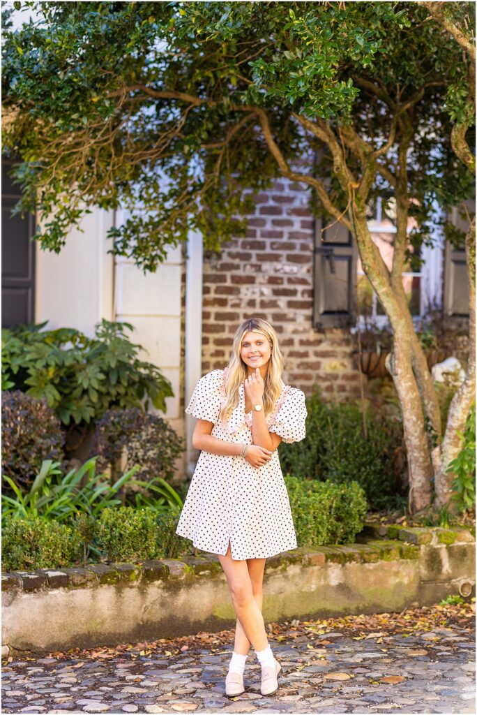 Close-up of Bella’s face with natural light illuminating her features along Tradd Street.