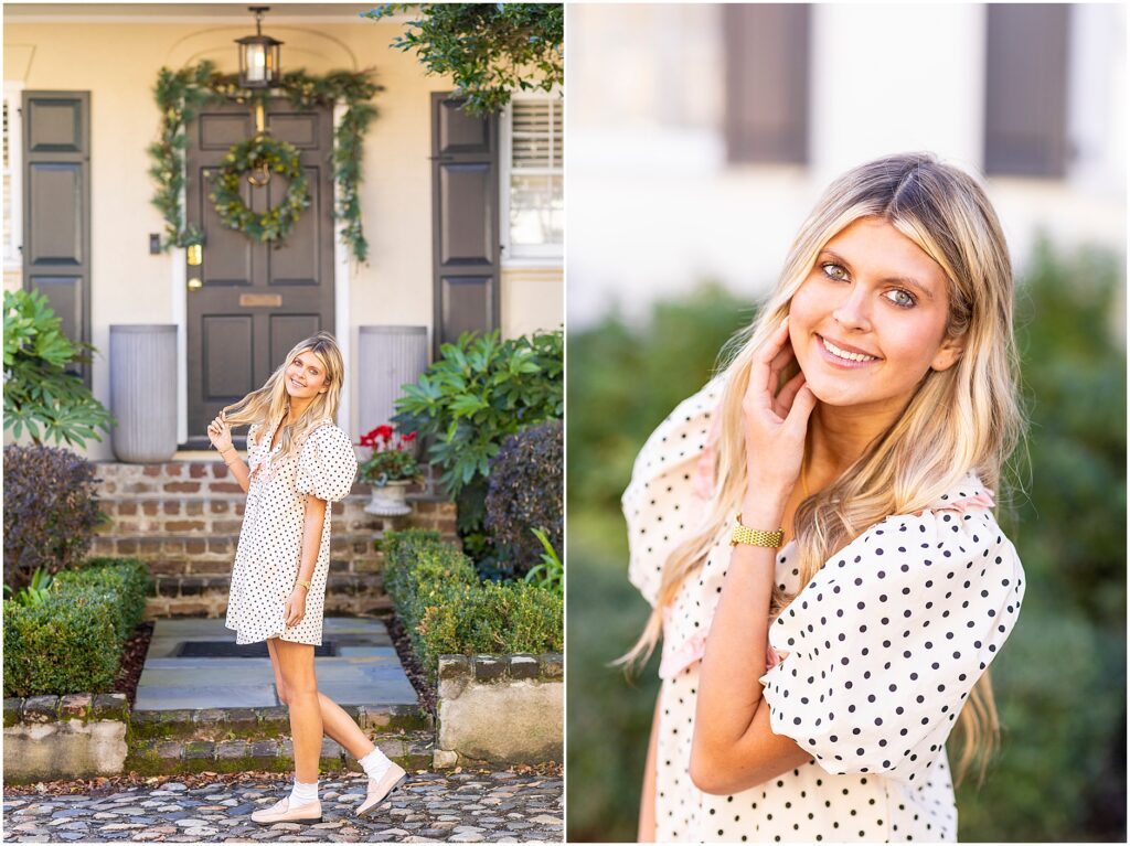 Bella standing under an archway near Rainbow Row with Charleston greenery framing her for senior portraits.