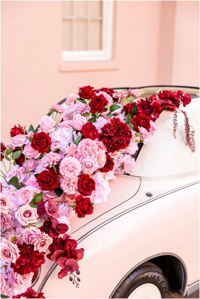 Detail shot of The Pink Figgy dressed in red and pink florals from The Charleston Petal parked at the Mills House Hotel on Queen Street in Downtown Charleston, South Carolina