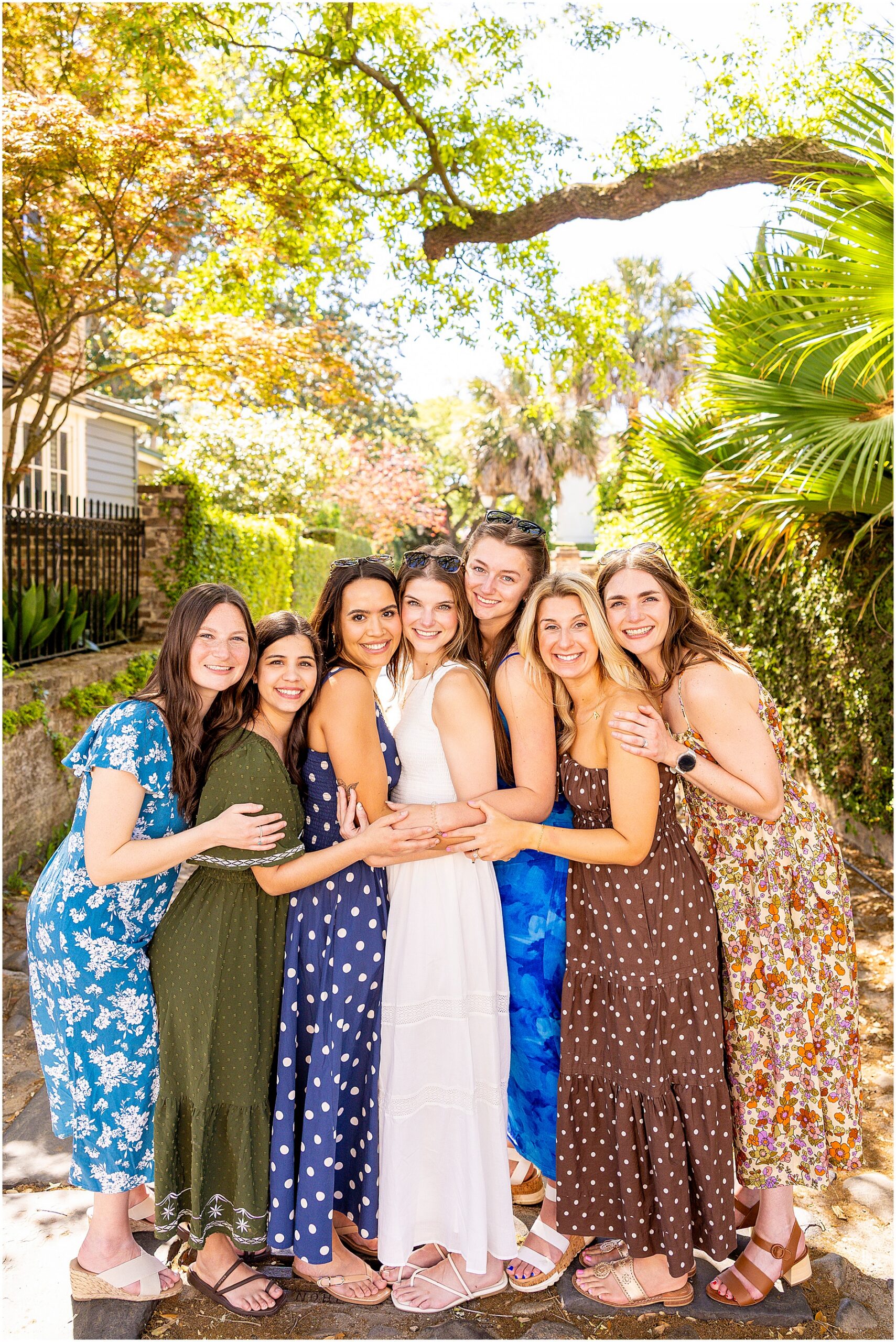 Charleston bachelorette photoshoot with stylish sundresses and colorful city backdrop