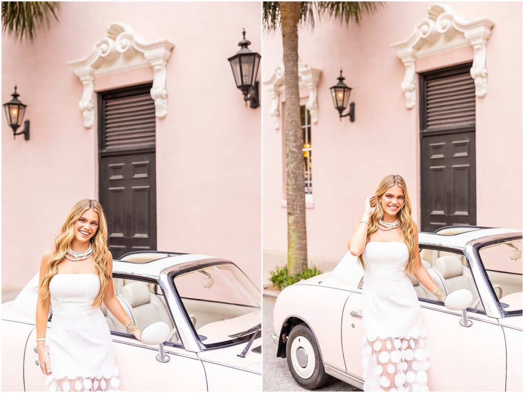 Senior girl in white dress smiling as she poses outside the Mills House Hotel in Charleston alongside The Pink Figgy