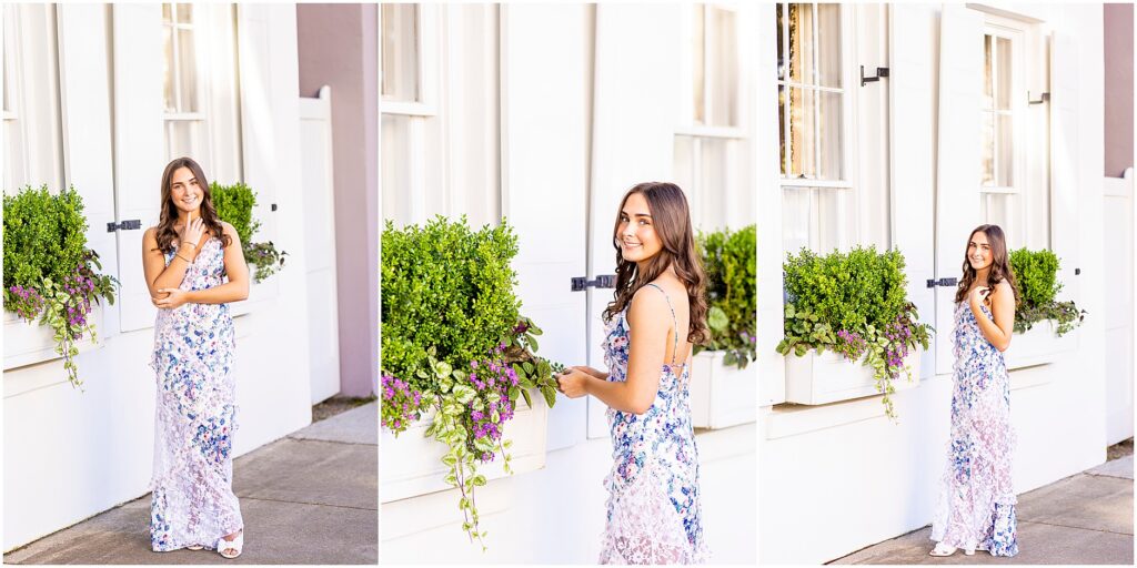 Charleston senior photos on Rainbow Row in front of a white home with greenery in the window boxes