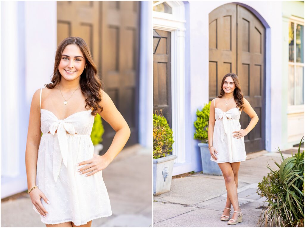 Girl posing with her hand on her hip as she poses for her high school senior photos in Charleston along Rainbow Row