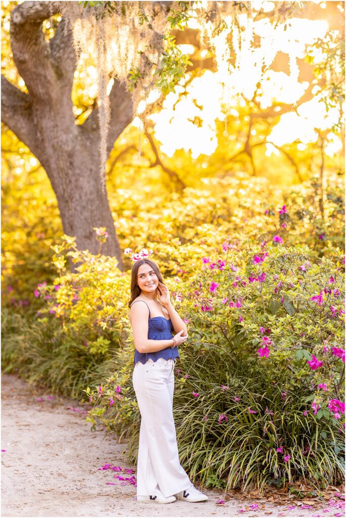 Soft senior photo in Hampton Park with golden hour light pouring in