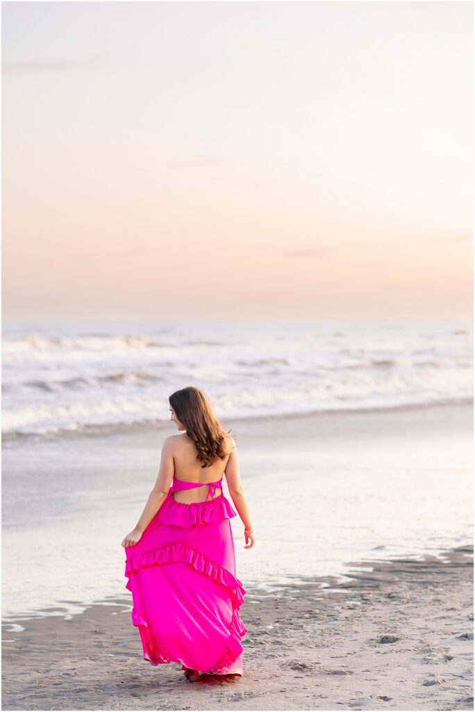 Sunset senior photo on the shoreline of Folly Beach in Charleston, South Carolina