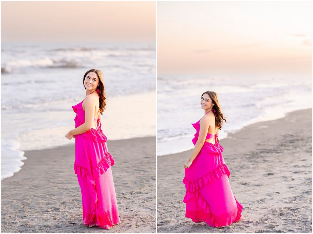 Senior posing in a hot pink dress by the ocean at Folly Beach during sunset