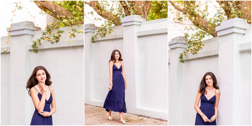 Downtown Charleston senior portraits with pastel buildings and evening light