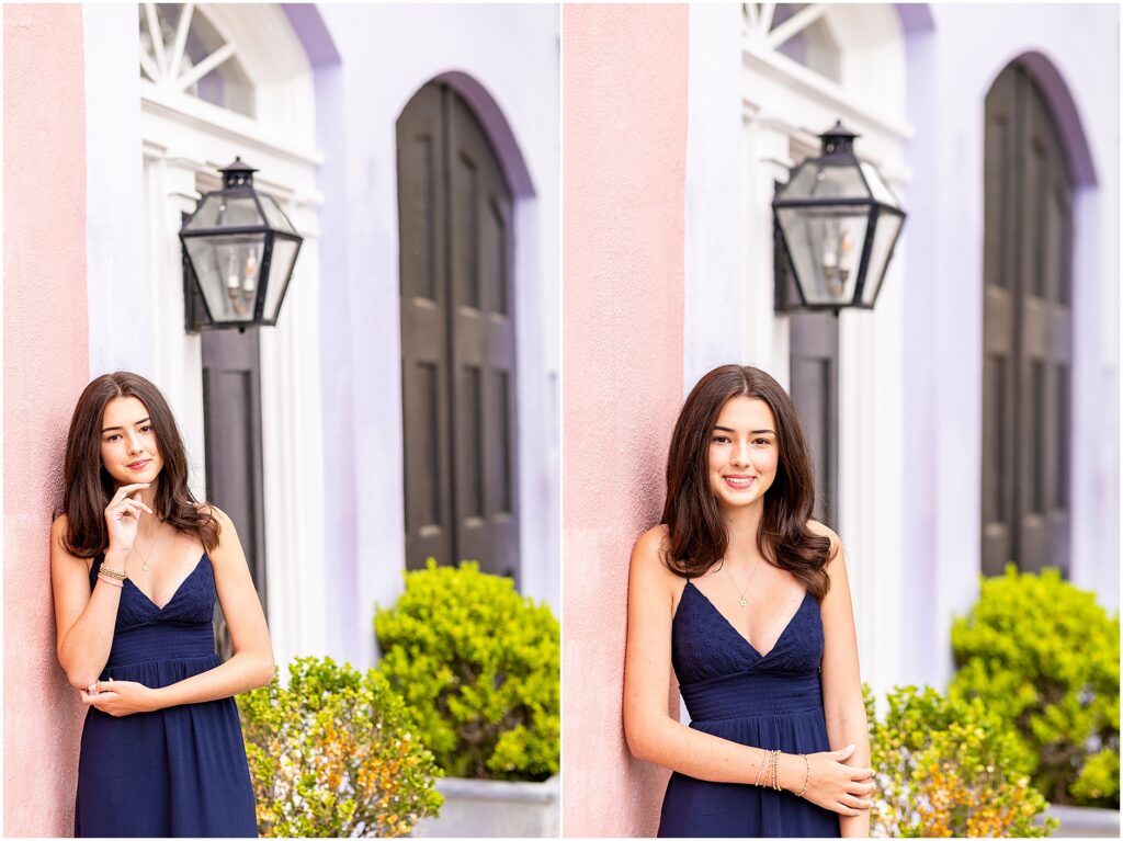 Senior girl smiling in front of Rainbow Row during Charleston photo session
