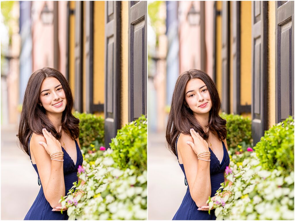 High school senior posing in front of colorful houses and window boxes on Rainbow Row Charleston SC
