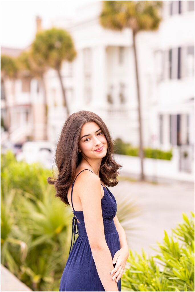 Senior photos at The Battery Charleston with historic homes and waterfront views