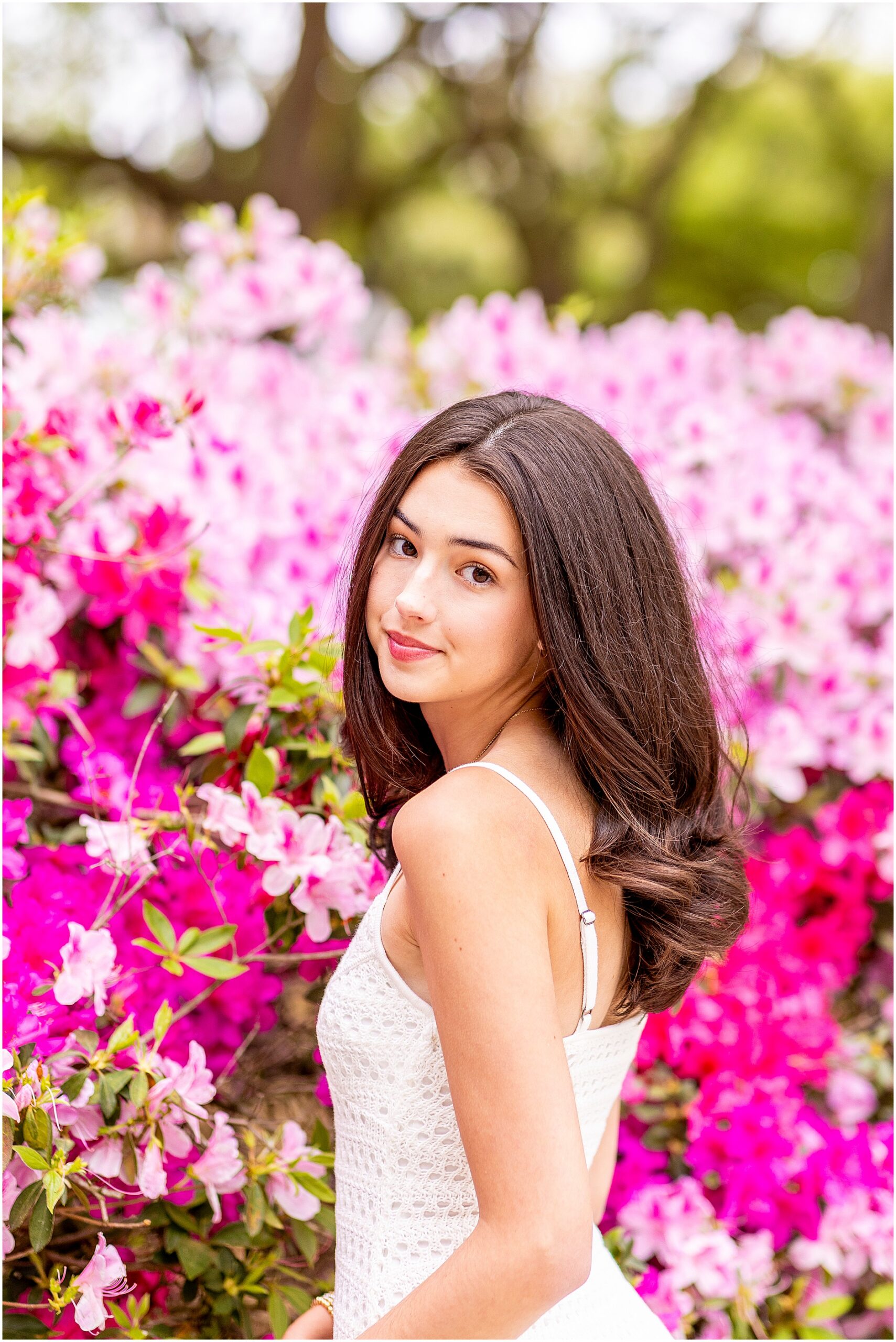 Senior photos in White Point Garden Charleston with blooming azaleas