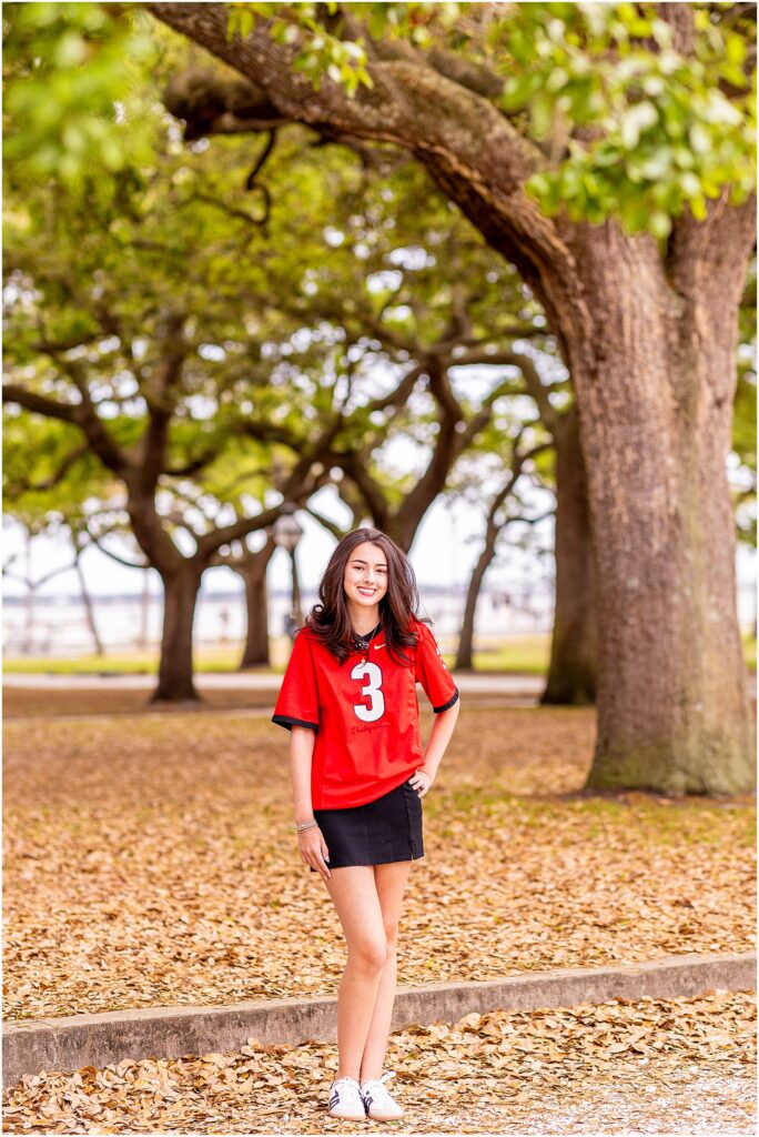 University of Georgia senior photos in Charleston with college jersey