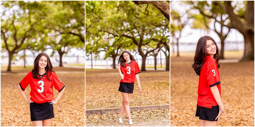 High school senior wearing University of Georgia jersey for graduation photos