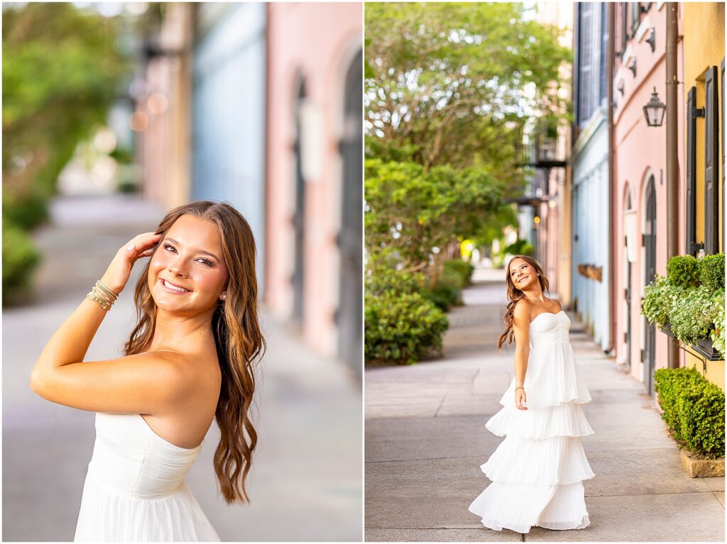 Girl in white flowy dress twirling along Rainbow Row as she gets her senior photos captured authentically