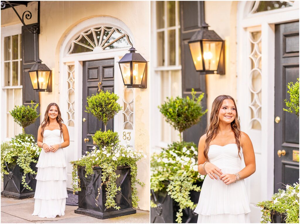 Joyful senior portraits in front of yellow home on Rainbow Row with greenery