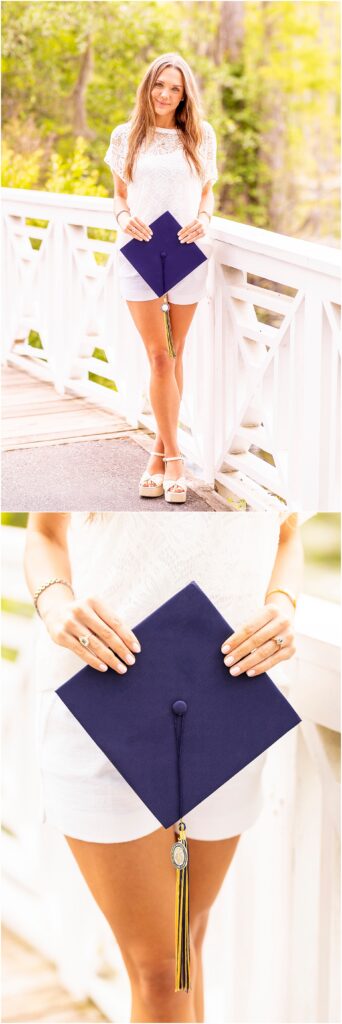 Senior girl holding her cap from Charleston Southern University as she poses on the famous bridge in Cypress Gardens