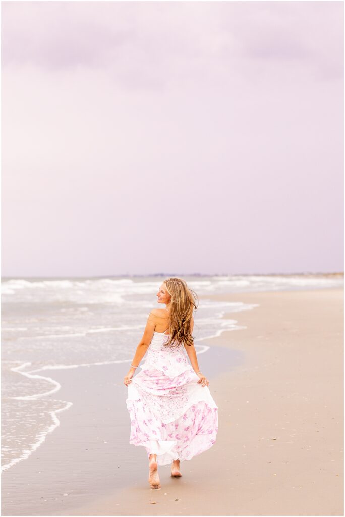 Timeless senior portrait at Isle of Palms capturing a relaxed coastal moment during sunset in Charleston