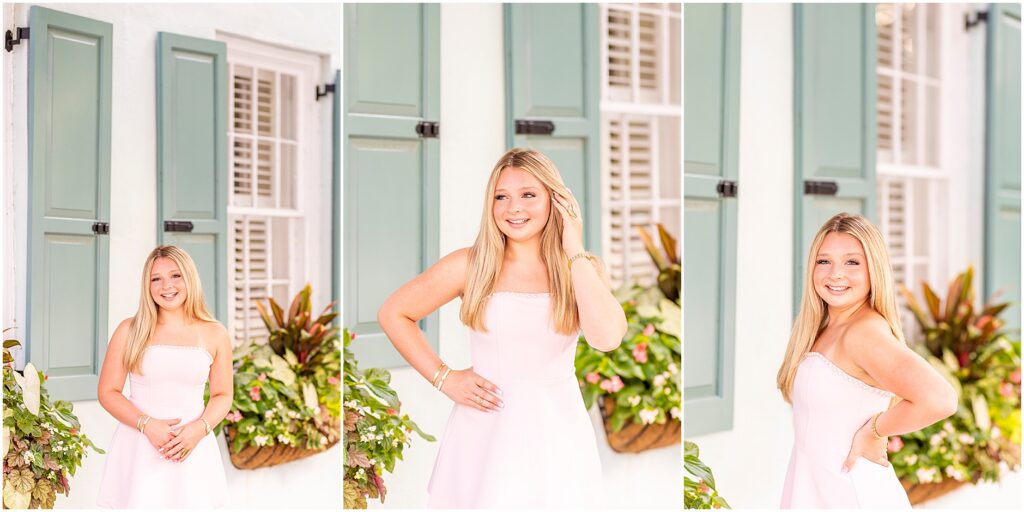 Senior portrait in front of Charleston's iconic Rainbow Row during a summer senior photography session.