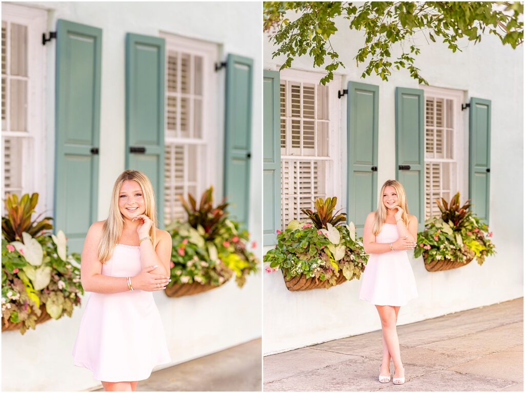 High school senior walking along Rainbow Row in downtown Charleston during golden morning light.