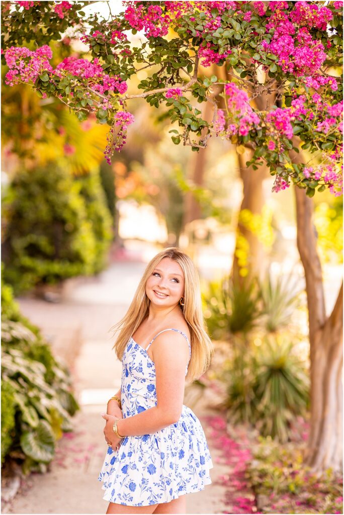 Destination senior session in Charleston highlighting Rainbow Row's colorful streets and historic charm.