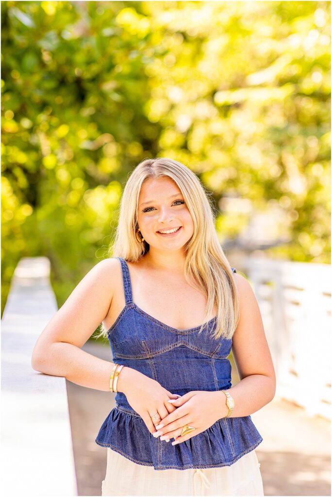 Destination senior photos surrounded by lush greenery at Cypress Gardens in South Carolina.