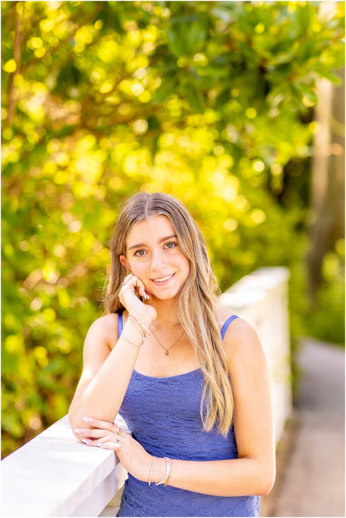 Destination senior photography surrounded by lush greenery at Cypress Gardens near Charleston.