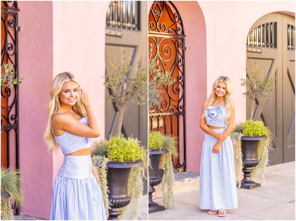 Charleston senior portrait of a girl in a long blue and white striped dress surrounded by pastel historic homes
