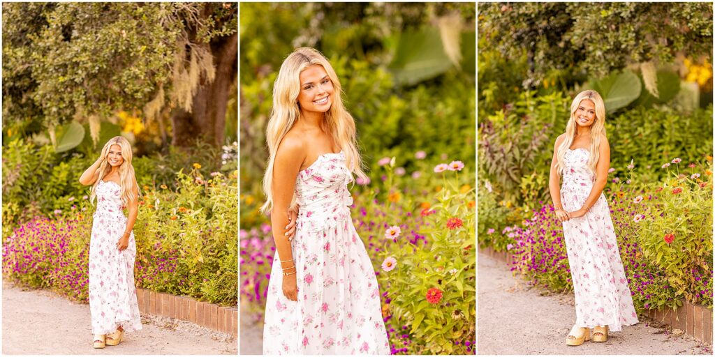Charleston senior portrait of a girl in a white and pink dress surrounded by vibrant Hampton Park florals
