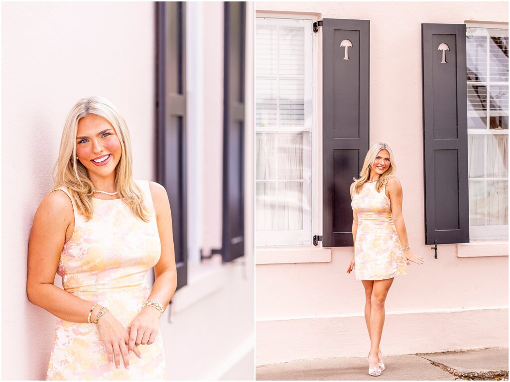 Charleston senior portrait of Makenzie in a colorful pink and yellow dress with a bow along Rainbow Row