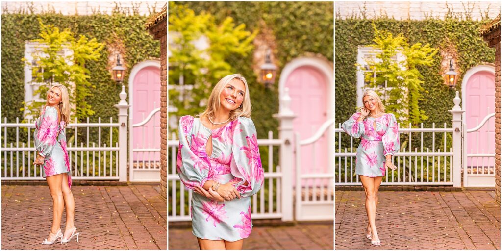 Charleston senior portrait of Makenzie in a blue and pink long-sleeve dress with a bow on the back in front of a pink door in South of Broad