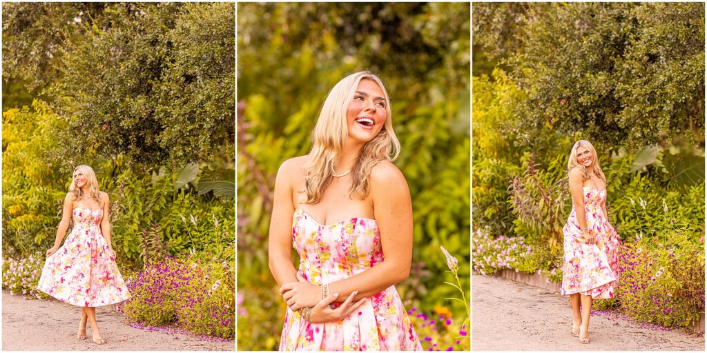 Senior girl smiling in a colorful pink dress surrounded by blooming flowers at Hampton Park in Charleston