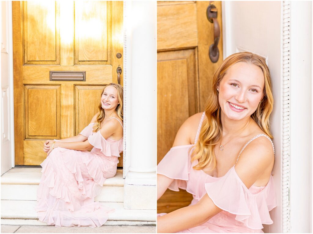 California senior posing in a pink dress among the colorful Charleston architecture of Rainbow Row