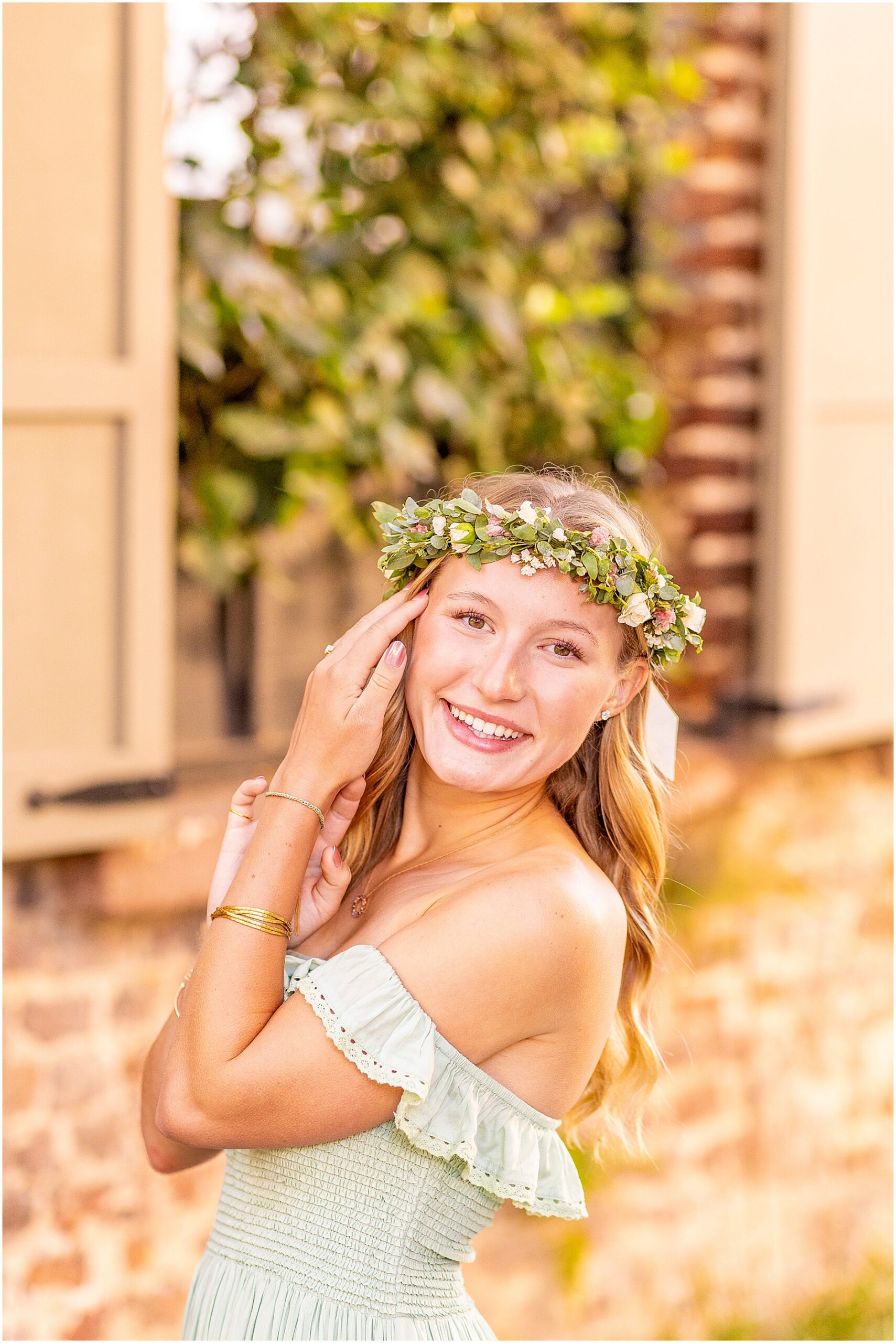 Charleston senior photography featuring a California senior in a whimsical green dress and flower crown